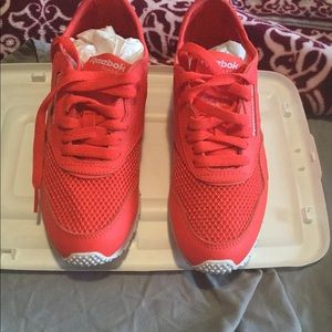 Bright red Reebok mesh sneakers